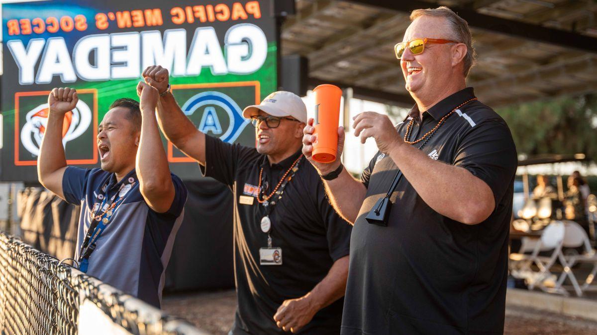 Rob Henderson cheers for the men's soccer team at a recent game